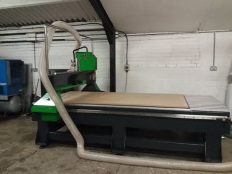 CNC router with vacuum table and dust extraction