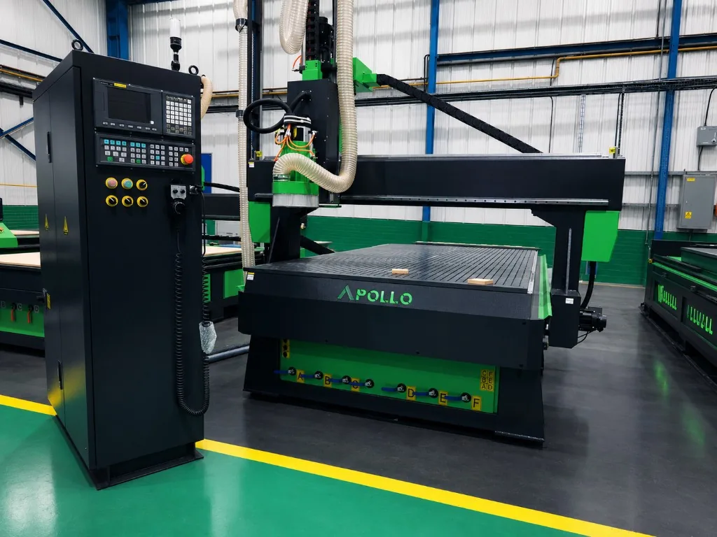 Apollo 4 Axis CNC router with Syntec control podium on the shop floor — black frame with green spindle housing