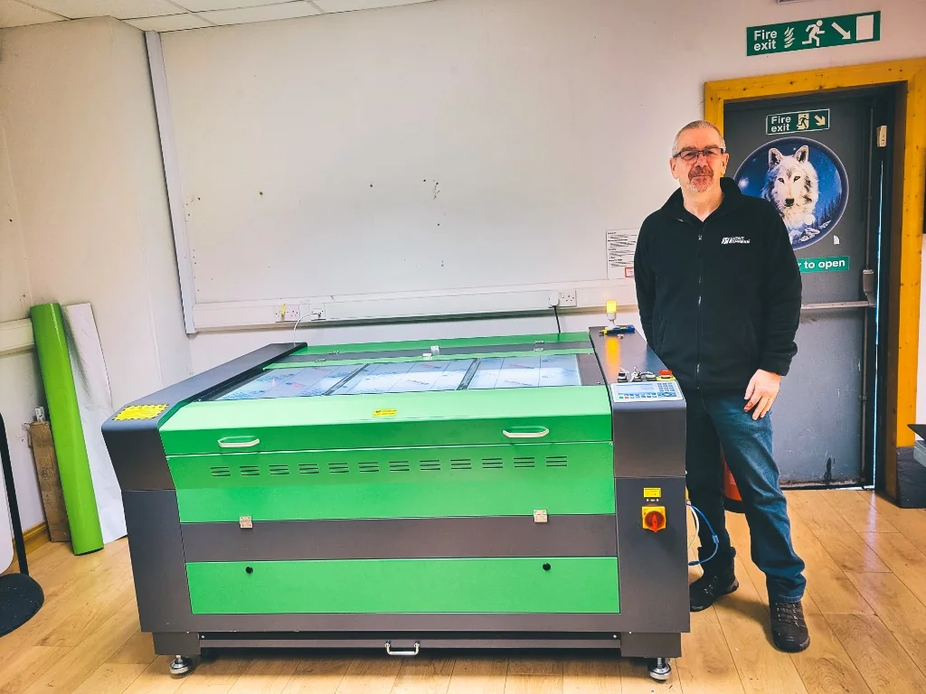 Signs Express operator with a Lasertech 90130 CO₂ laser cutter