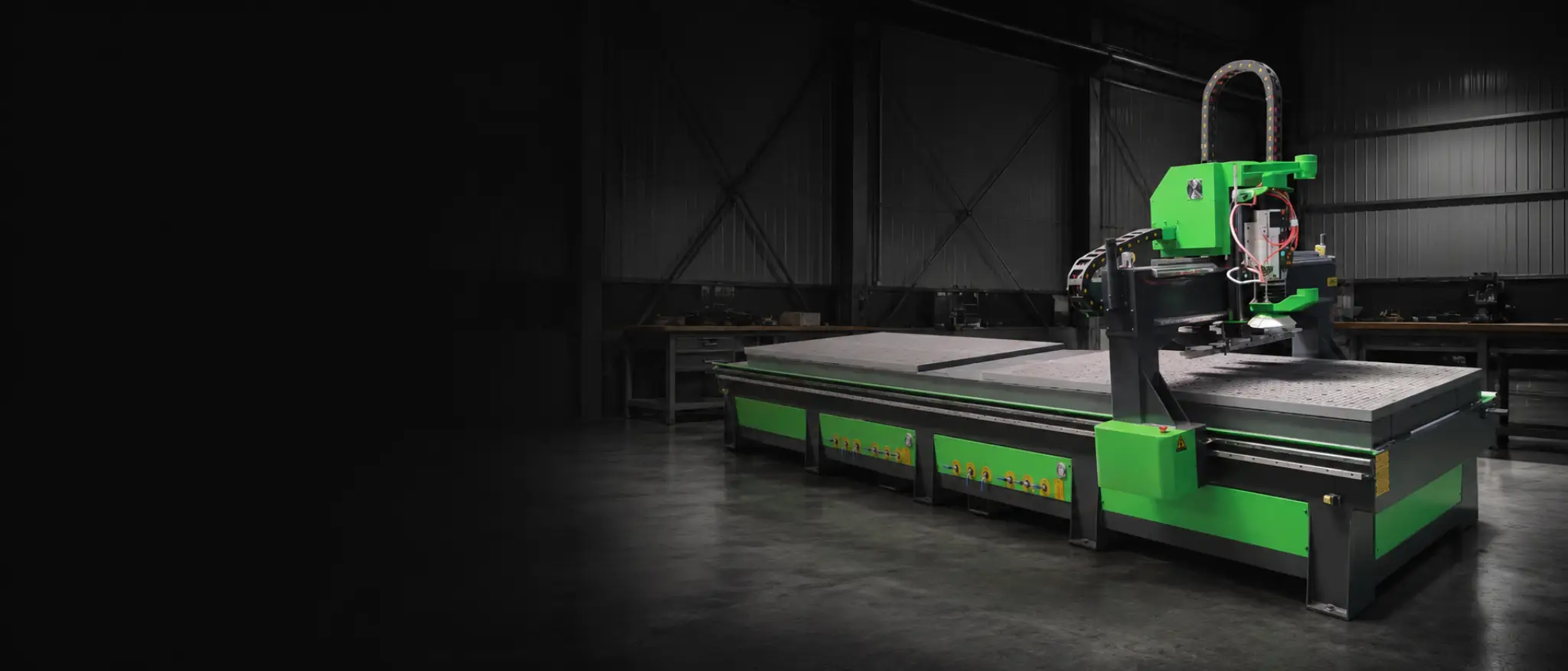 Dual Bed pendulum CNC router in a UK production workshop — twin 1325 beds with under-bridge automatic tool change