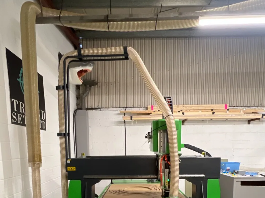 Falcon 1325 ATC cutting circular profiles in sheet timber on a 1300 × 2500 mm bed in Haddenham