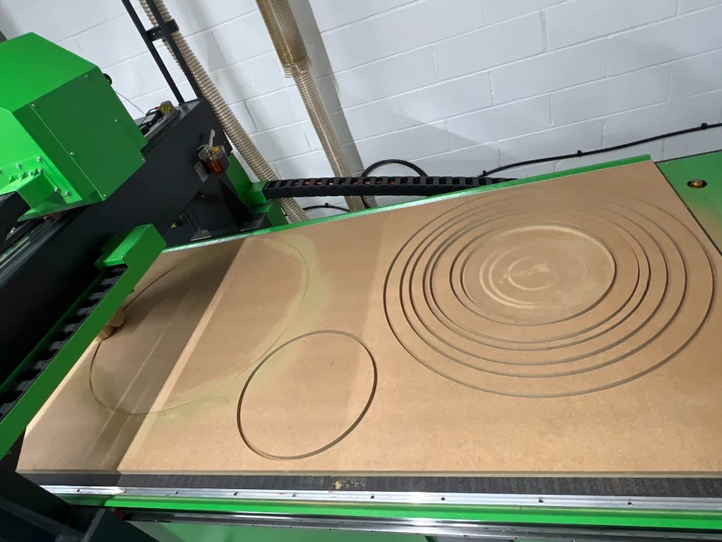 Close-up of circular profiling cut on the Falcon 1325 ATC bed at Treend Sets Ltd