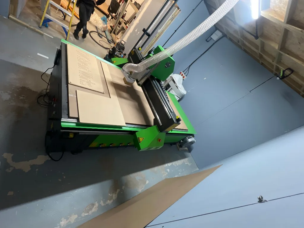 Spartan 1325 CNC Router machining sample panels during commissioning in Maidenhead