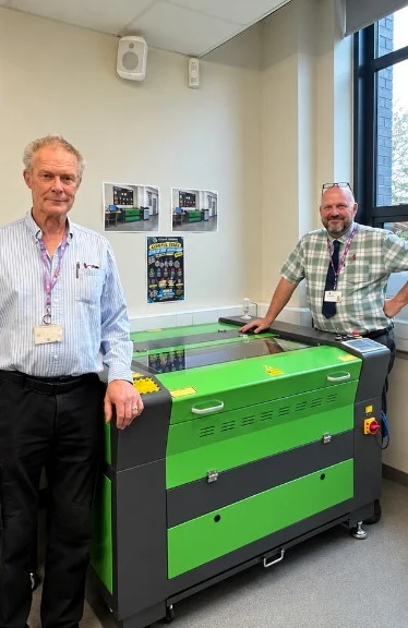 Oldbury Academy staff with a newly installed laser cutting and engraving machine in the Design and Technology workshop