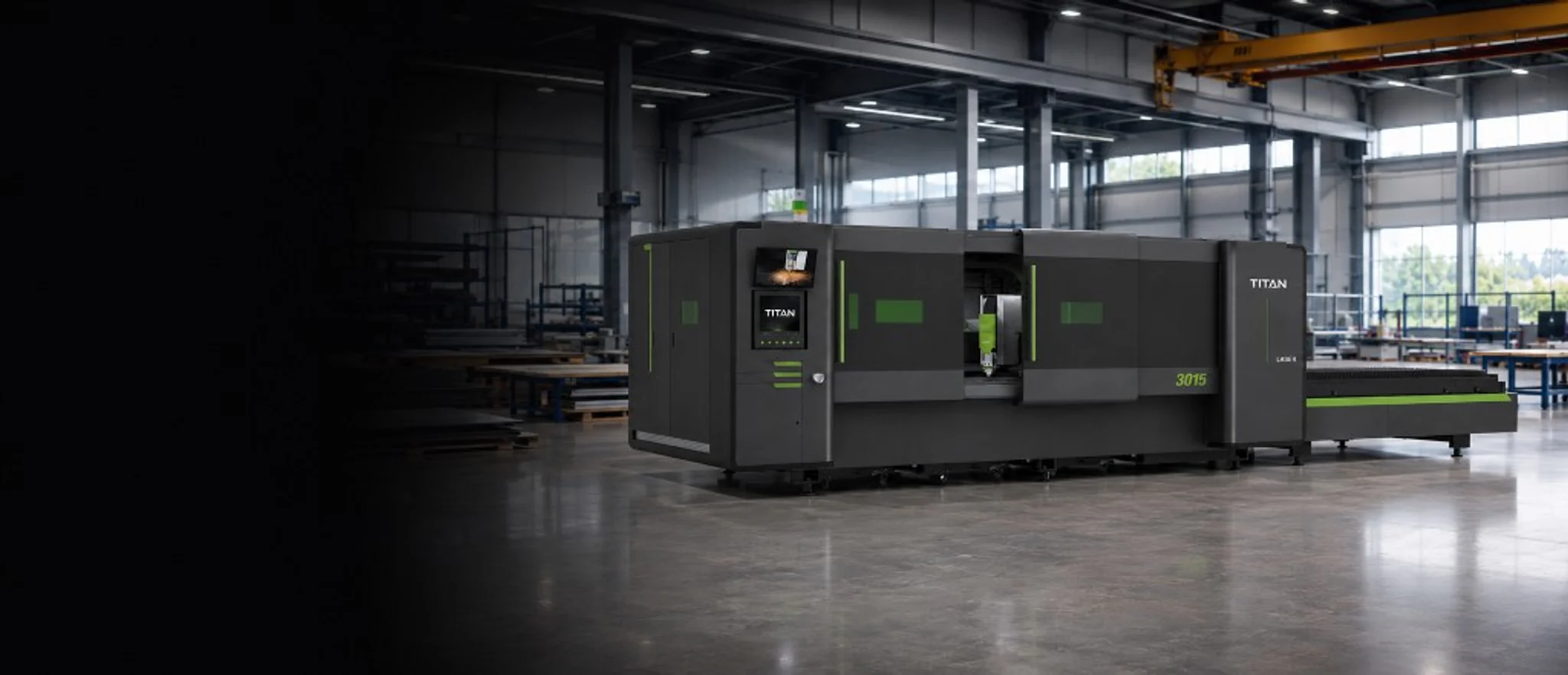 Titan FP3015 dual-shuttle flatbed fibre laser in a UK production facility — premium enclosed platform with FSCUT control station and exchange table