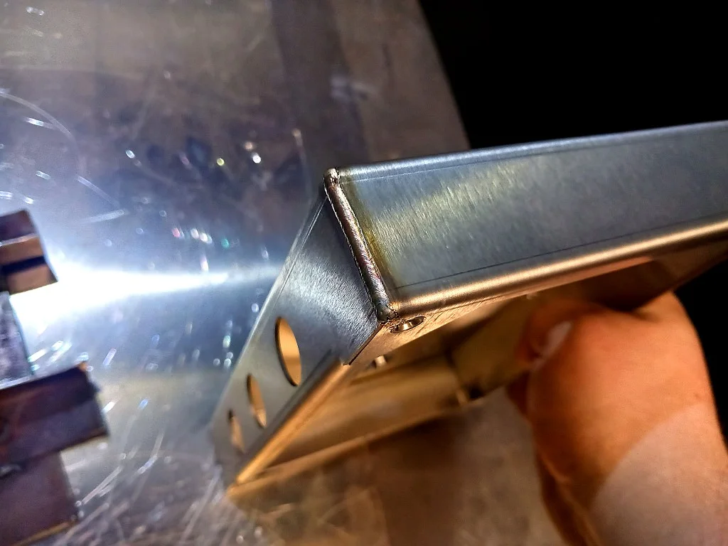 Close-up of a clean laser-welded stainless corner from the TRM LWH1500-P installation in Wokingham